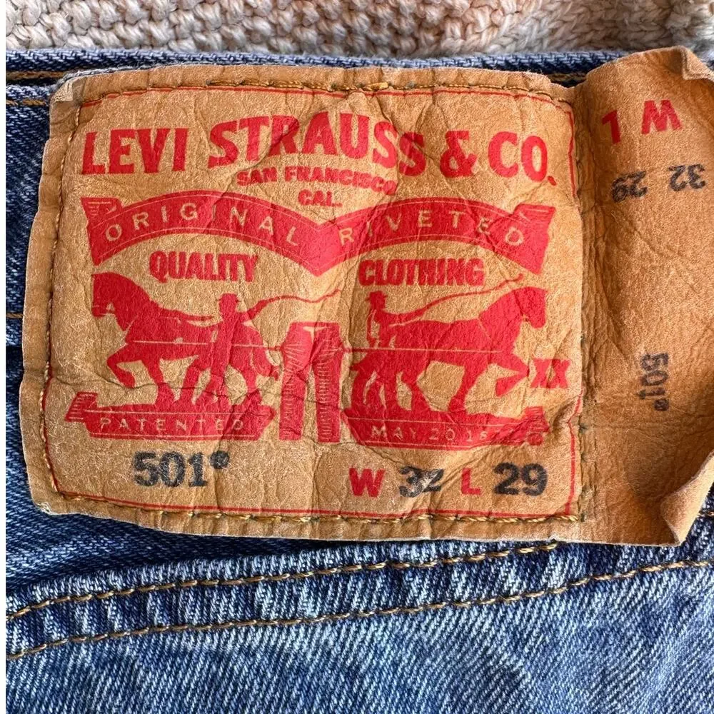 Vintage Levi's 501 button-fly jeans with Y2K's red batwing label